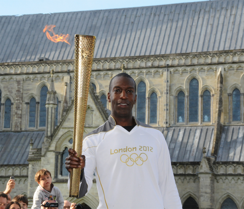Michael Johnson, with the Olympic flame in Salisbury