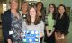 Carmella Lowkis (Centre Front) with staff and Volunteers from the Wiltshire CAB. St John’s student Holly Sumbler 2nd right