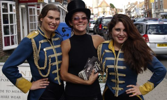 Ella, Ceri and Hannah from Gifford's Circus urge the crowds to roll up, roll up!