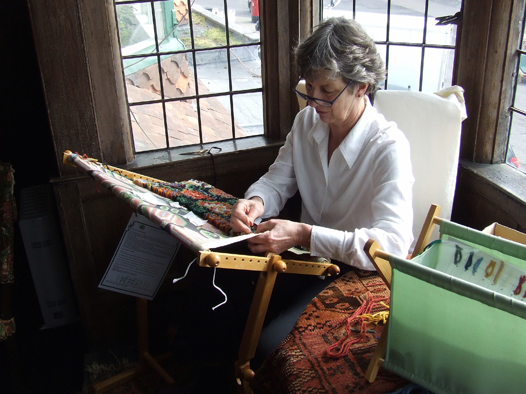 A volunteer exacting detail restoration work
