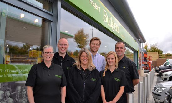 Jenny Cleverley, manager Frank Stevens, Sue Stevens, shops development manager Nick Fraser, Katie Mills, and group operations manager Mark Wilson outside the new Budgens of Marlborough store