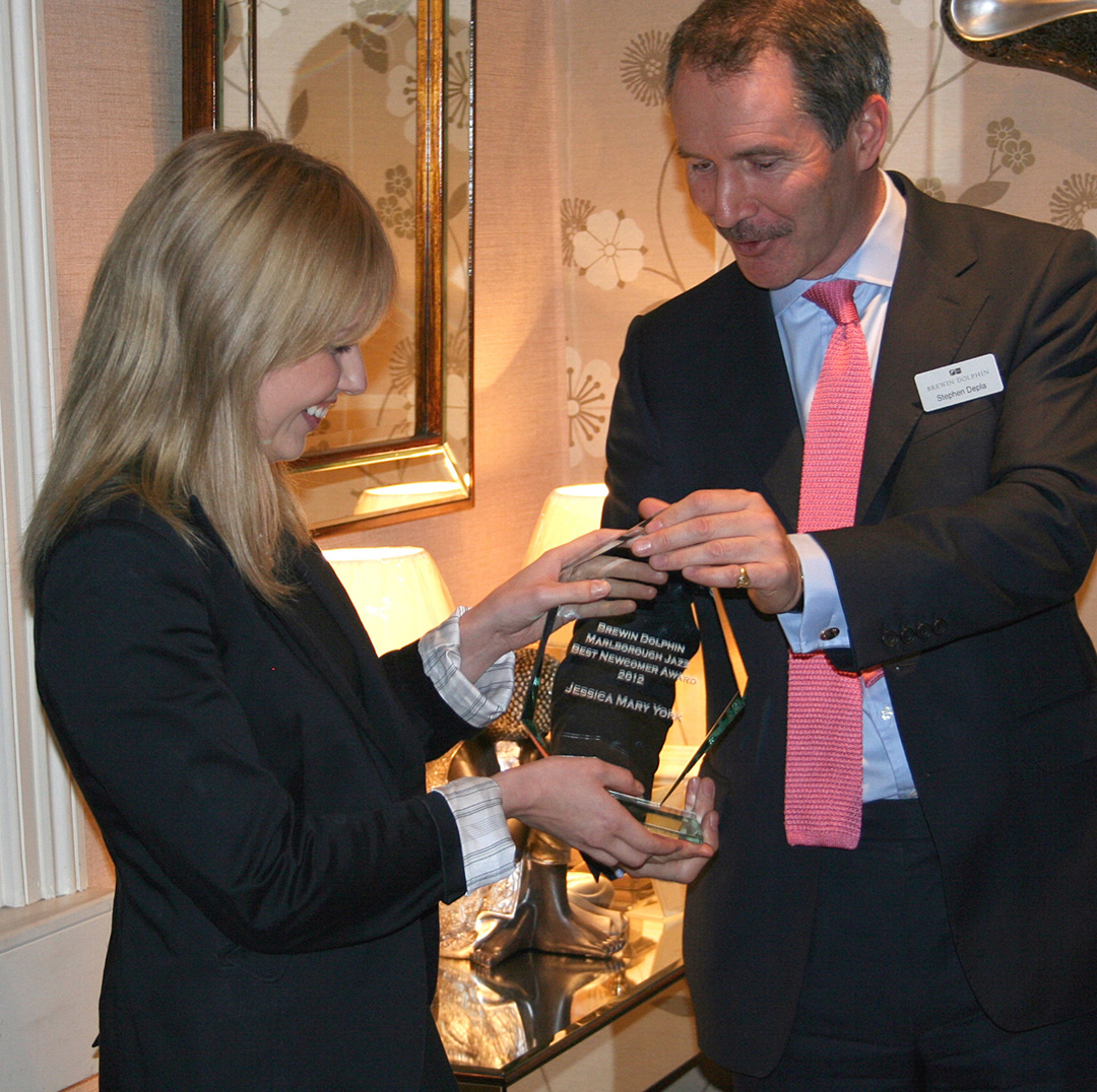Jessica Mary York accepting trophy from Brewin Dolphin's Stephen Depla