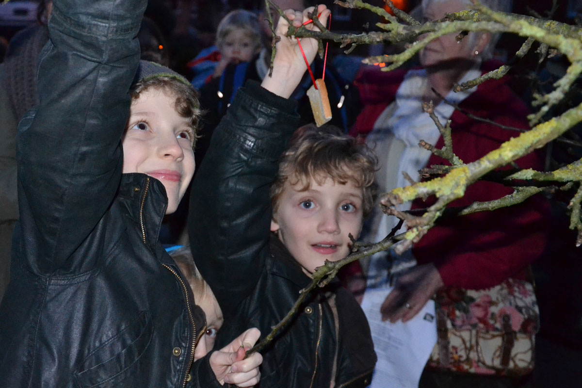 Max and Ben Murphy offer toast to the robins, the guardians of the apple trees