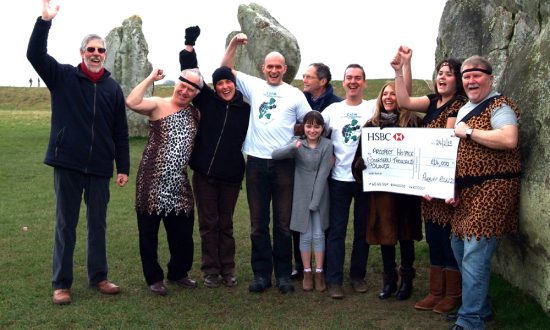 Dave Frampton and Bob Barrett of Marlborough and Swindon Thamesdown Rotary Clubs (in costume) presenting cheques to Sheryl Crouch and Amy Fisher from Prospect Hospice, with Richard Crowley and Mark Lenton-Jink of CALM, and little leukemia survivor Alyssa Lenton-Jink