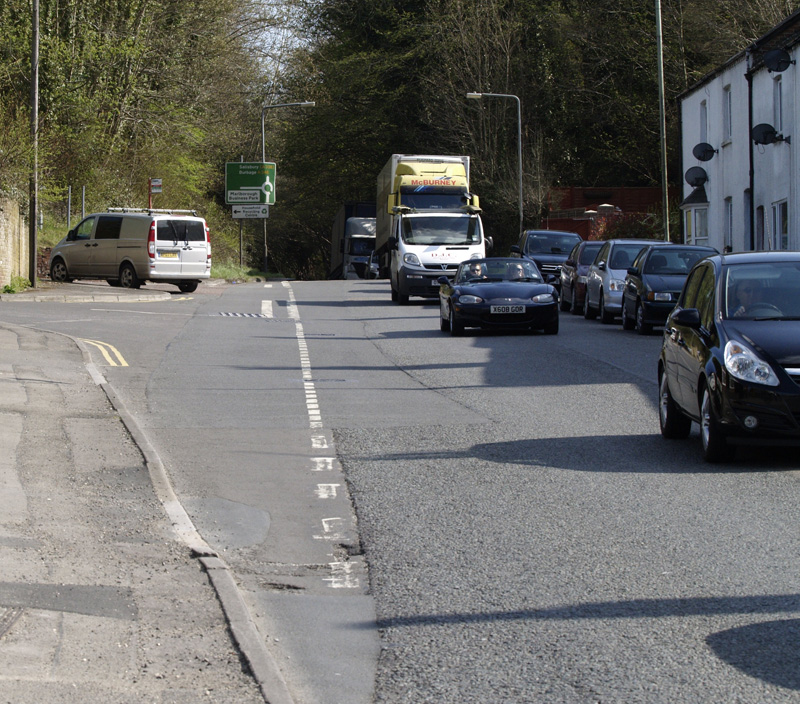 The site entrance is by the vehicle on the left of the photo