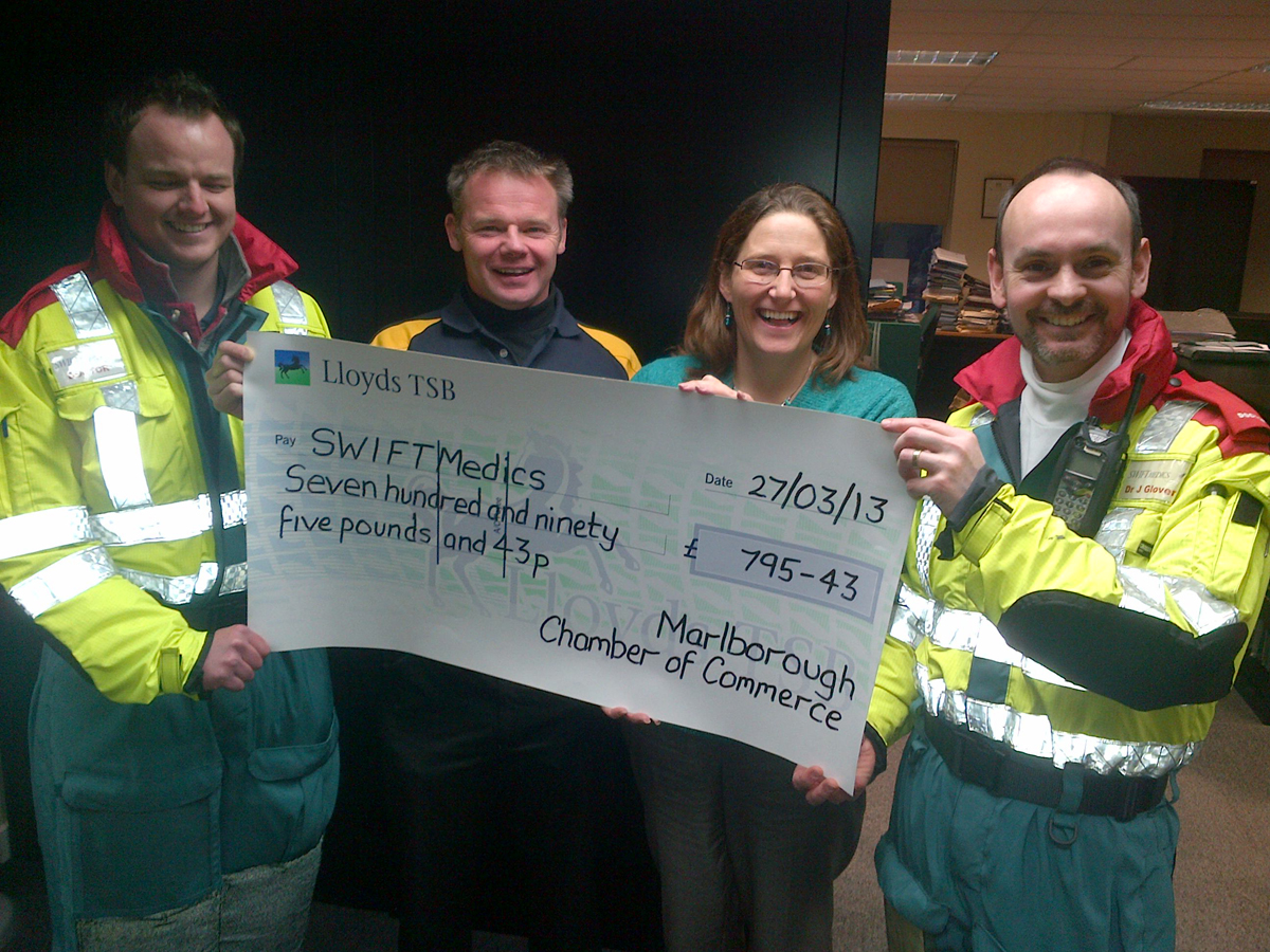 Chamber president Paul Shimell and treasurer Rachel Atkins (centre) present a cheque to doctors Dan Bawden (left) and Jonathan Glover (right)