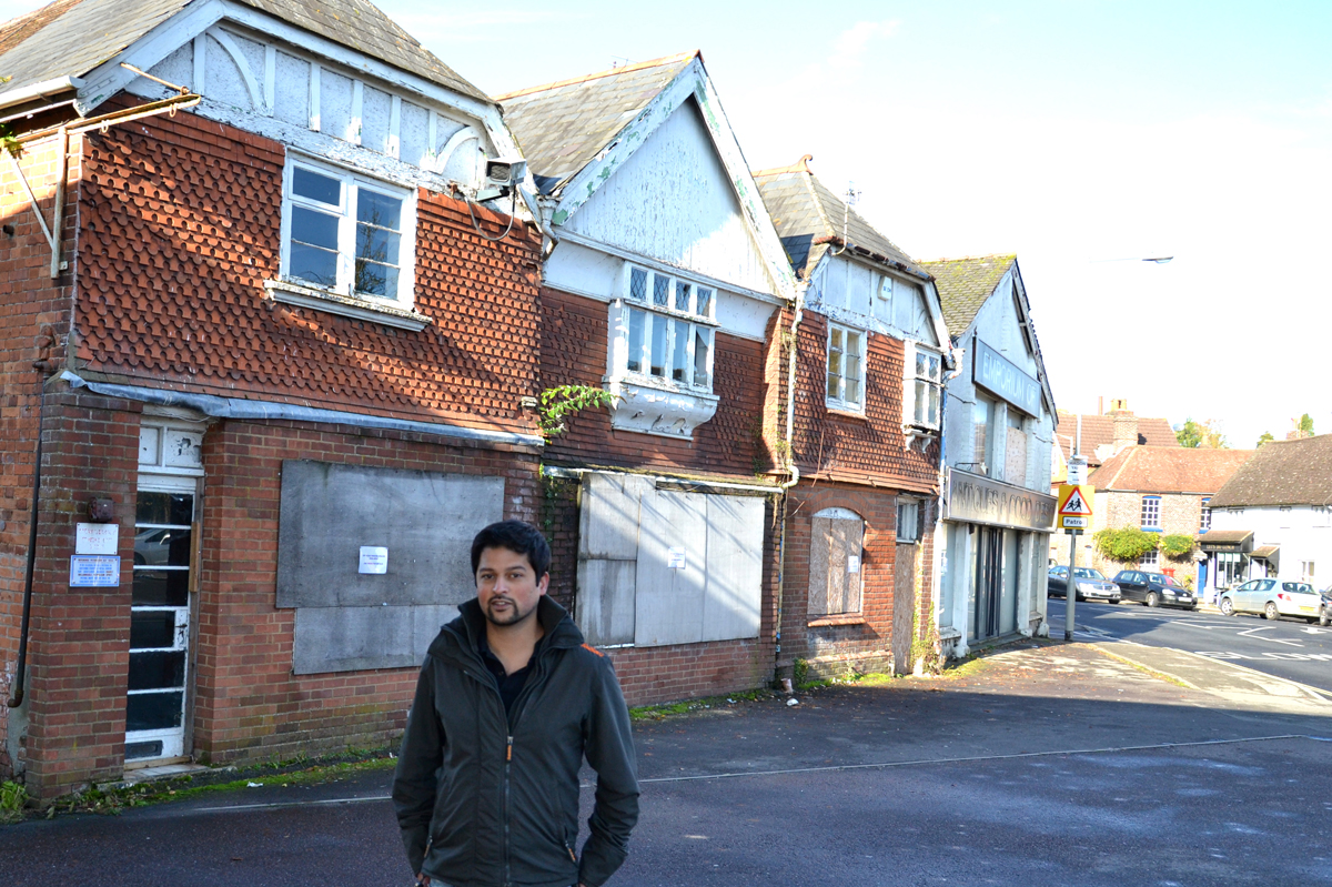 Alex Dean in front of the existing 18th century buildings