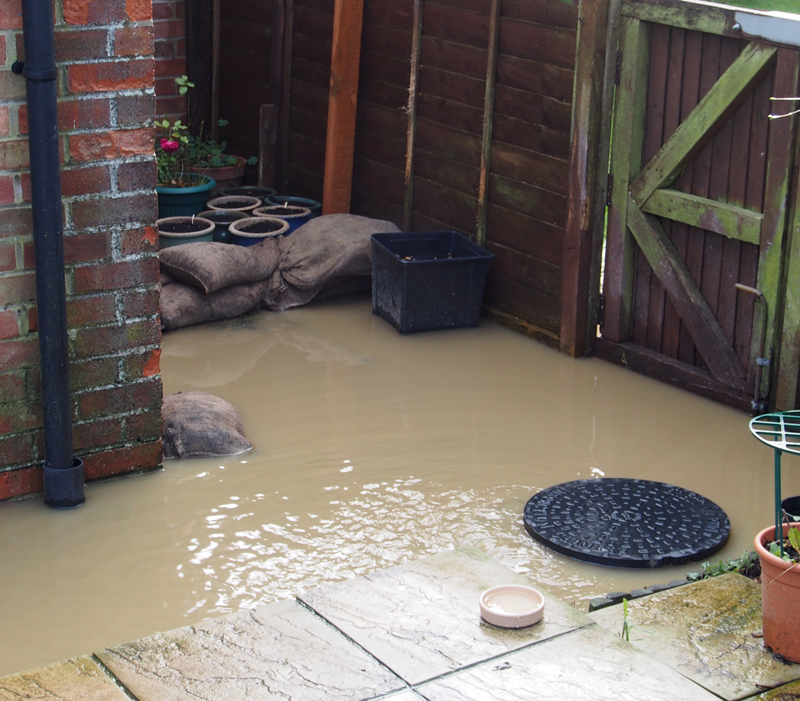 Sewage laps around a bungalow on The Knapp