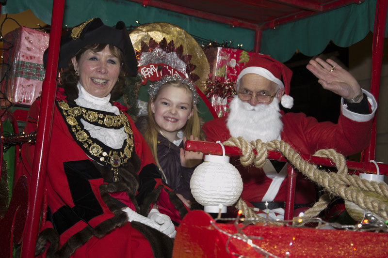 The mayor with schoolgirl Ella Steele and Santa aboard his sleigh