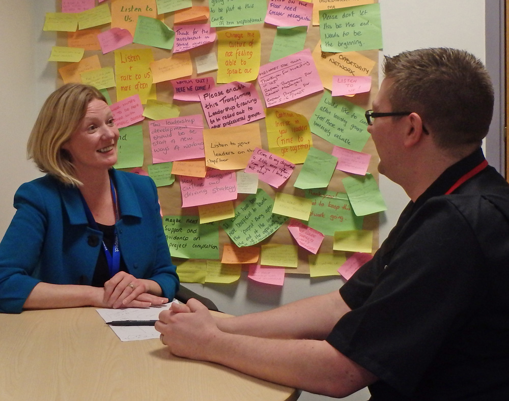 Oonagh Fitzgerald gets a report from Chris Bull, Matron overseeing Site Management and Patient Flow