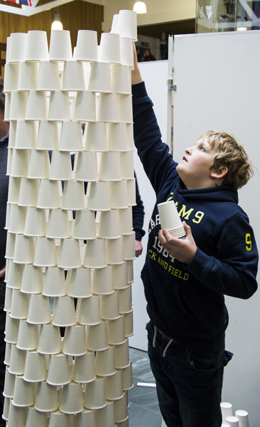 Arthur Allen (10) builds his paper cup tower