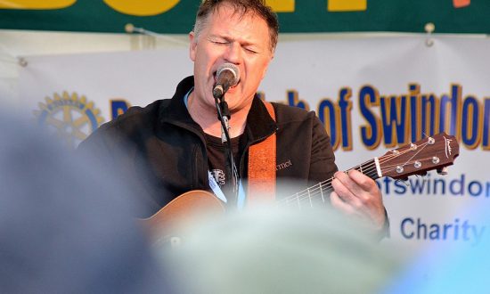 Nick Harper on stage at Avebury Rocks in 2012