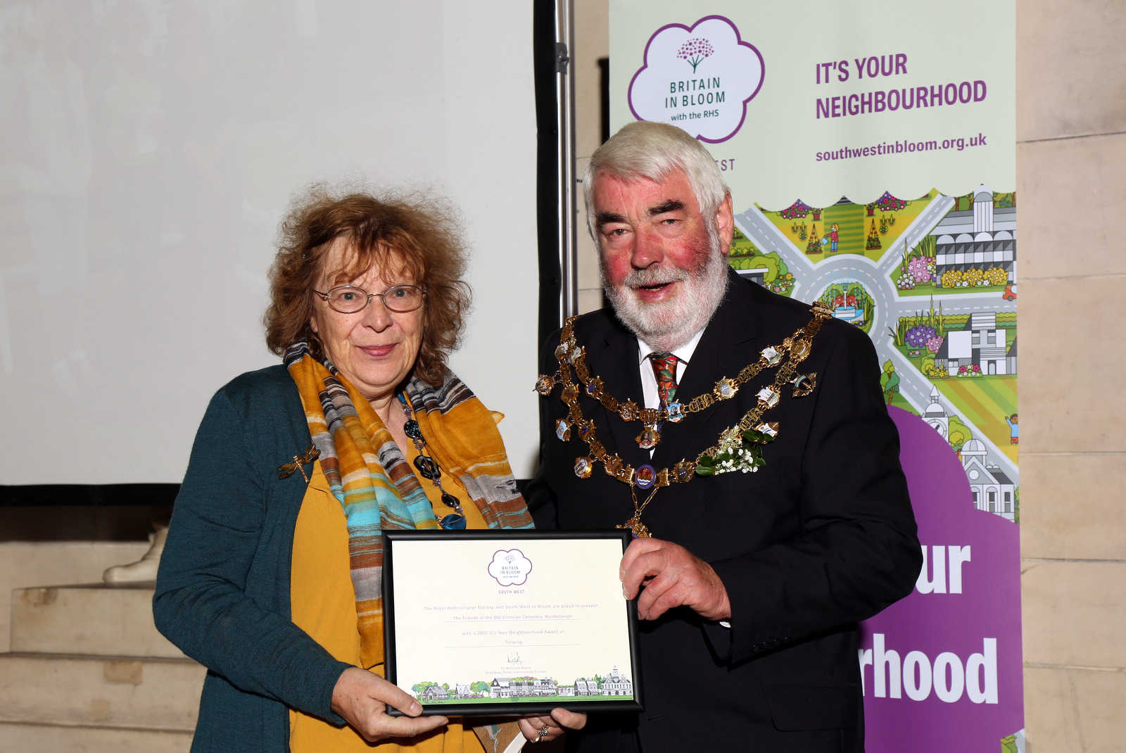 Clare Russell collecting a certificate for Manton in Bloom from the Dartmouth Mayor, councillor R M Lyon