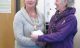 Founder & managing director Helen Yeadon (r) receives the cheque from Mayor Margaret Rose