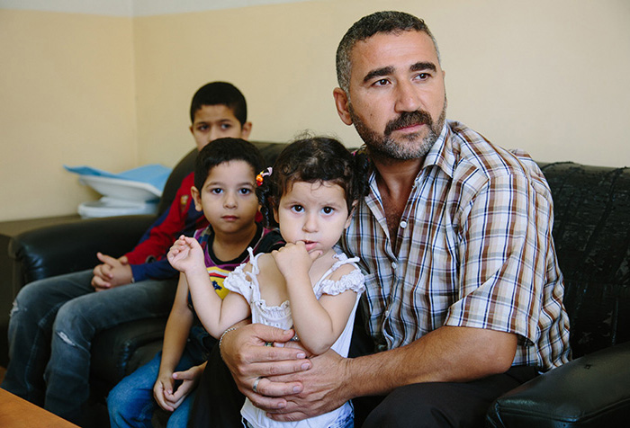 Refugees at a health centre in Lebanon (Photo: Nadim Kamel for IA)