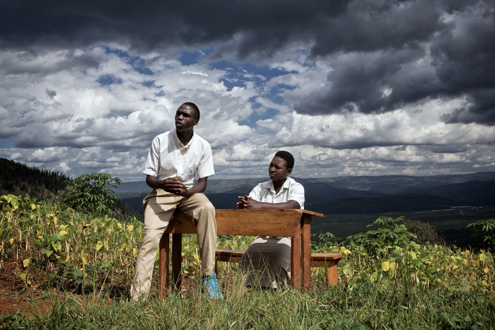 Rwandans beneath uncertain skies (Photo: Carol Allen Storey for IA)
