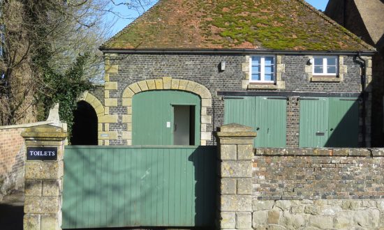 The entrance to the Ladies toilet is through the open door in the arched doorway - the food outlet is behind the two closed double doors to the right
