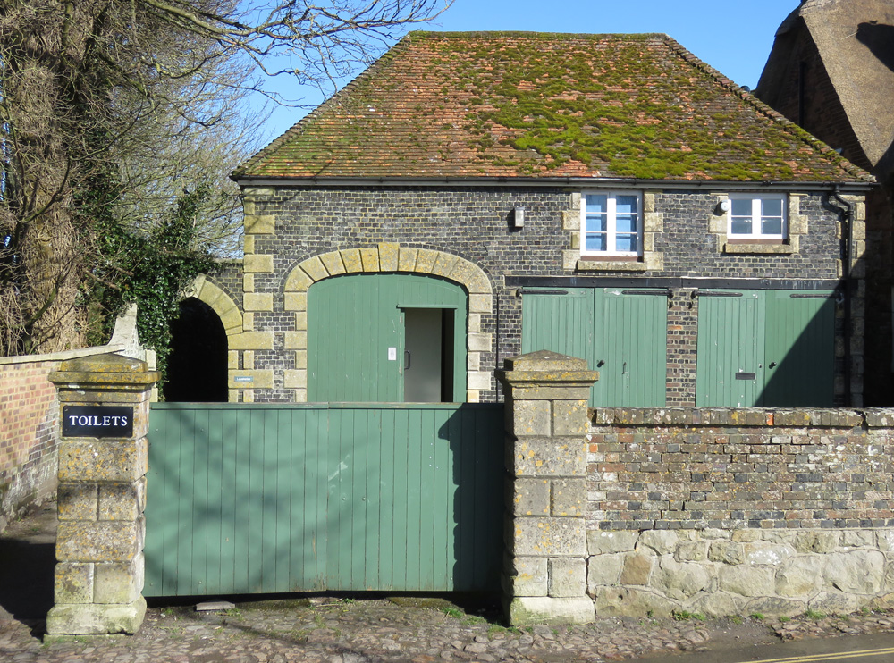 The entrance to the Ladies toilet is through the open door in the arched doorway - the food outlet is behind the two closed double doors to the right