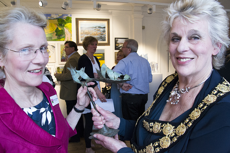 Sioban Coppinger and mayor Margaret Rose with Spring in Step, a shoe of ash leaves in cast bronze