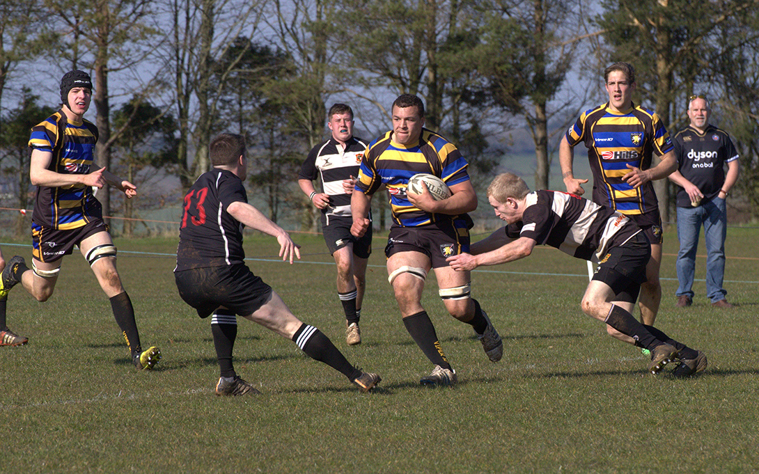 Another trade mark charge by Jack Lynd watched by Sam Gouldbourn and Jamie Laing