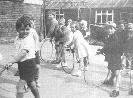 A photo from the book: the playground in the 1940s - when hoops were made of wood