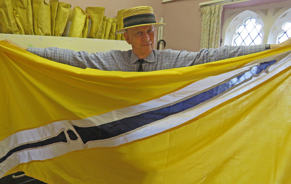 Major York with the flag of the Shakepeare Family Arms