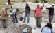 Archaeologist Mike Parker Pearson celebrates reaching the bottom of one of the pits (Photo: Abby George - copyright National Trust)