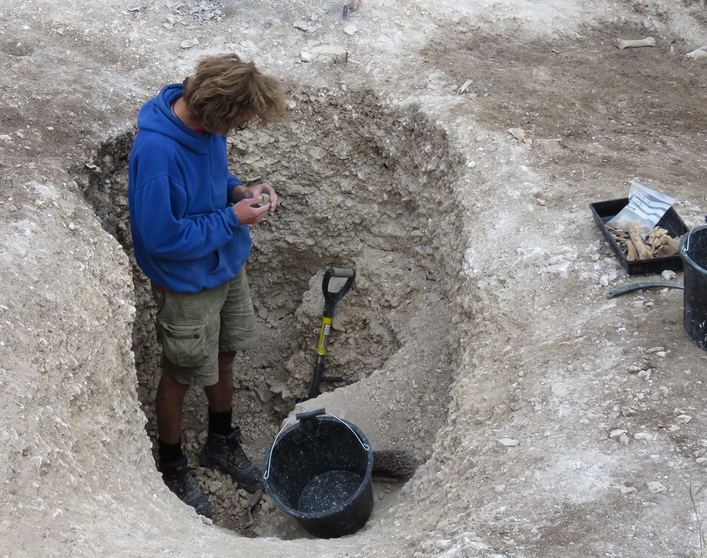 Checking a find in the eastern pit
