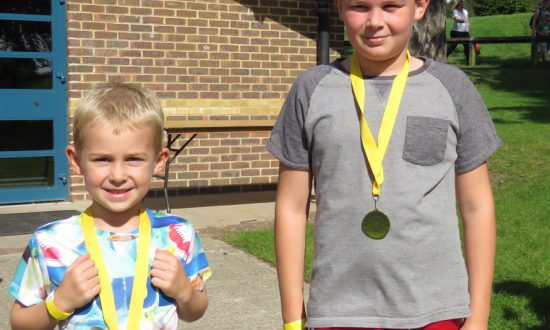 Triathlon completed: Lucas & Adam Blundy with their medals