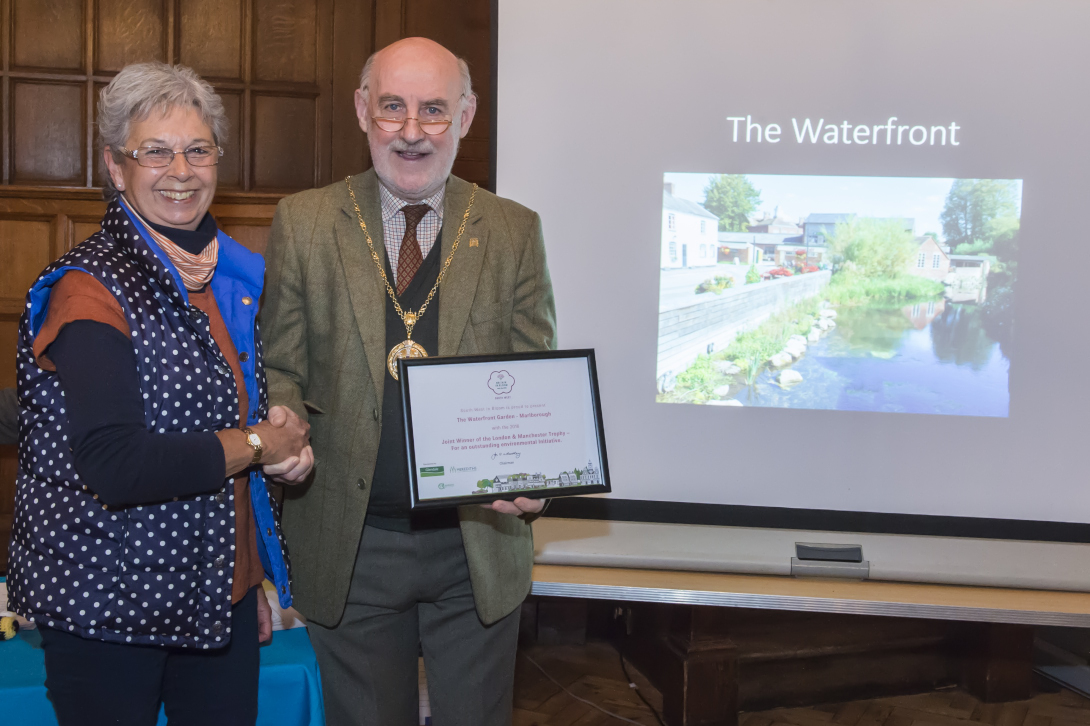 Mayor Cllr Noel Barrett-Morton presenting Val Compton of the acclaimed Kennet Waterfront with their In Your Neighbourhood'  Outstanding certidficate