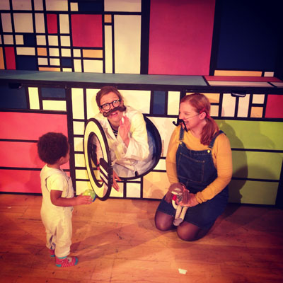 Molly, Molly the Dolly, the scientist, two moustaches and a tiny fan