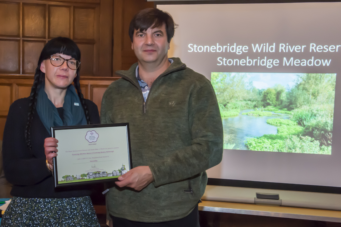 Richard Beale presenting Anna Forbes of ARK with their Outstanding award for the Stonebridge Wild River Reserve an Stonebridge Meadow 'In Your Neighbourhood' entry