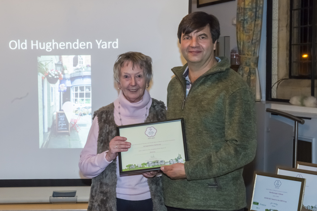 Richard Beale presenting Chair Anne Crawley with an Advancing 'In Your Neighbourhood' award for the Old Hughenden Yard entry