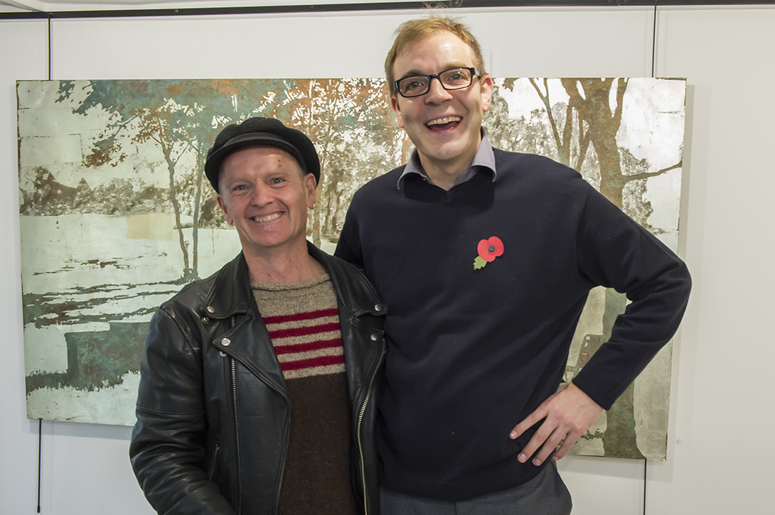 Owner Justin Cook (r) with artist Matthew Broussard, in front of one of his creations