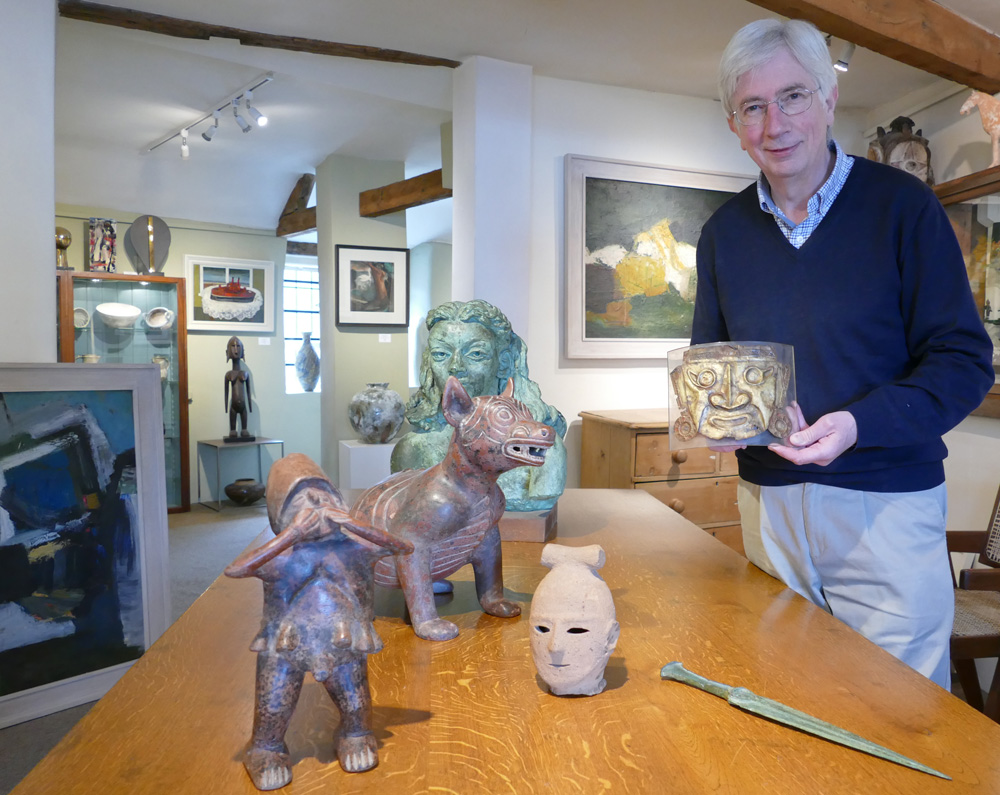Chris Gange holding the Sican Gold Mask - with other items including the Luristan Bronze Short Sword