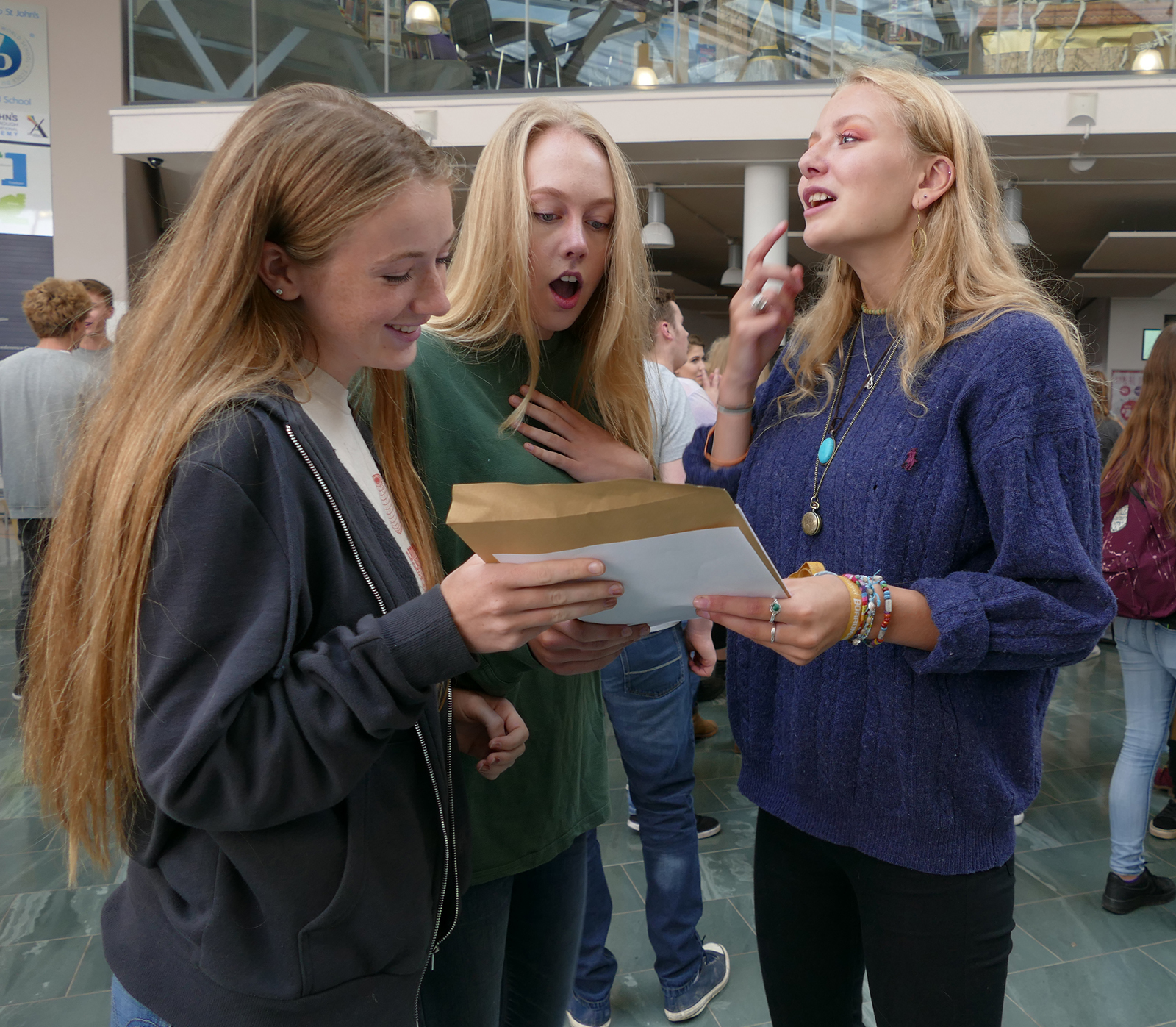 St John's student Natasha Ashbridge opens her results 9A*, 1A, 9,9, 8 with friends Katie Mcque and Ellie Dunn