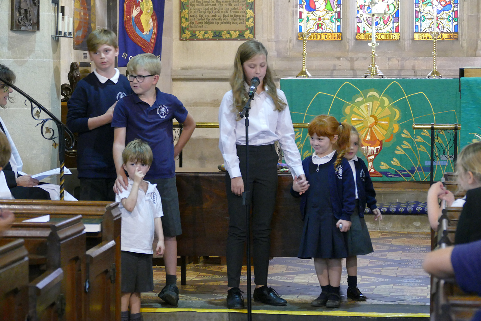 Year 6 and Reception pupils from Preshute C of E Primary School pair up as buddies in a service held in St George’s Church, Preshute