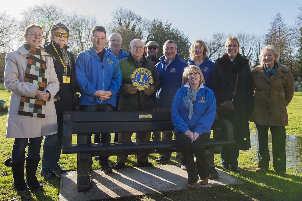 Members of the Marlborough Lions group around the new bench