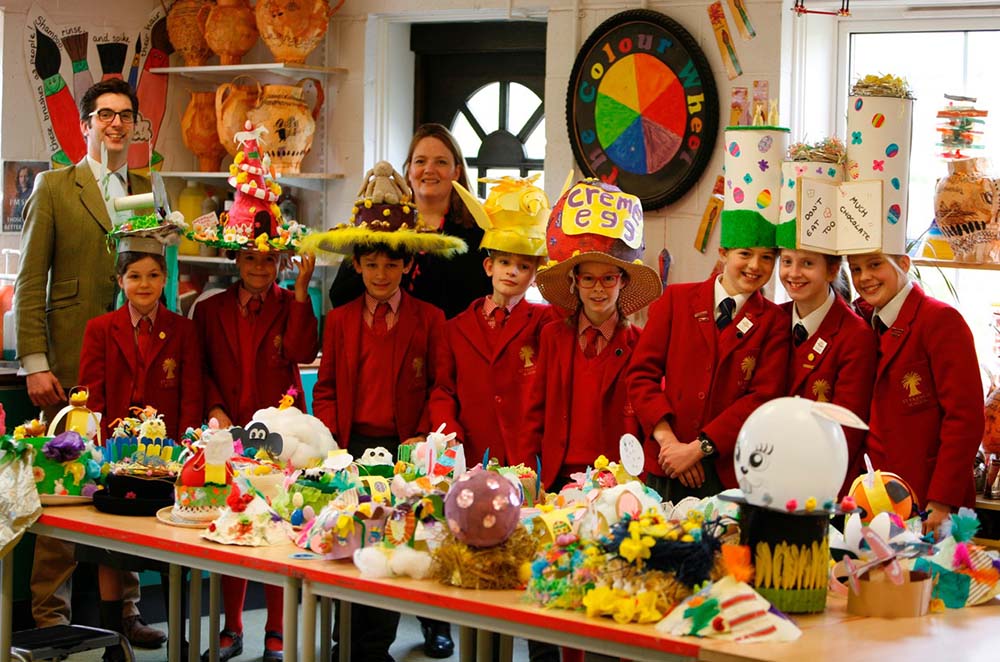 St Francis pupils with their winning bonnets with Head of Art Jo Parkes and Ed Taylor from Carter Jonas