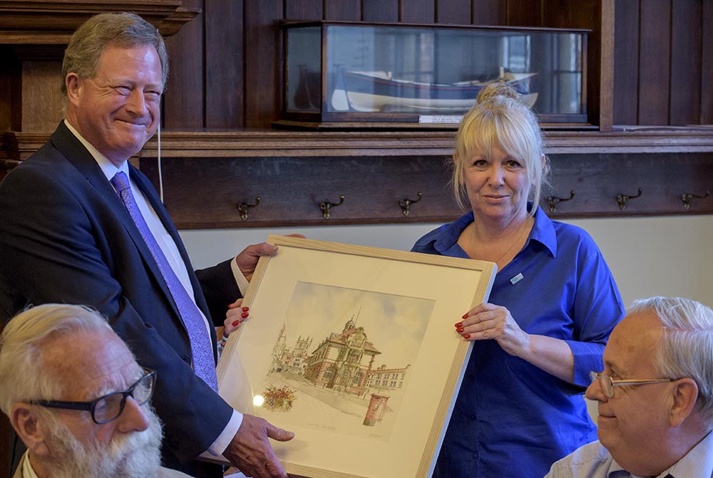 Dr Hazlewood receives the print from Marlborough Mayor, Councillor Lisa Farrell