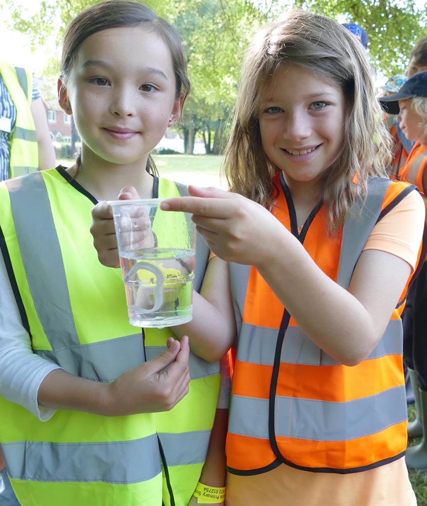 Preshute pupils with the eel they named Jeoff the largest of the batch
