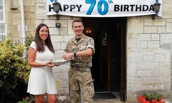 Bedwyn Partner Dr Anne Woods shares celebratory 'NHS at 70' birthday cake with local resident Lt Col Alex Freeborn