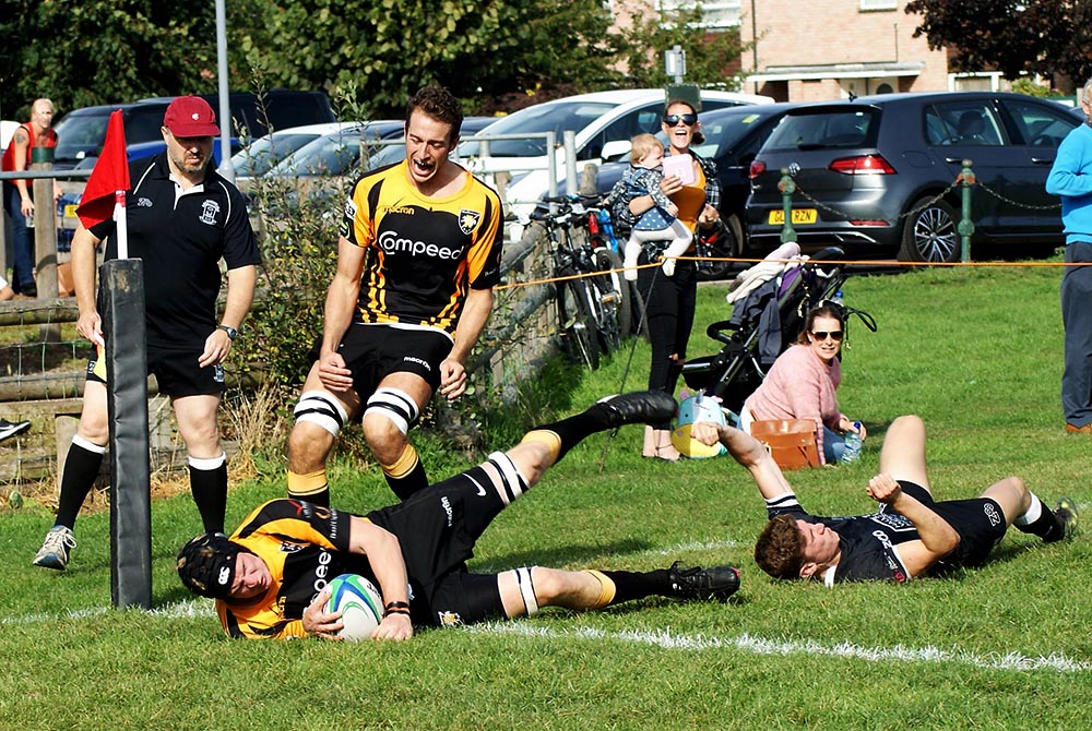 Patch Campbell goes over in the corner supported by fellow lock Jamie Pittams