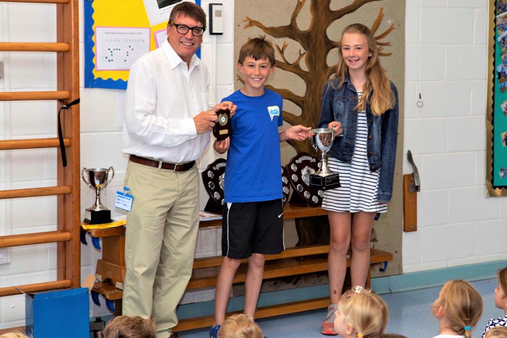 Steve Boocock, CEO of Wiltshire and Swindon sport presents top performing school in sport trophies to Year 6 Sport Leaders