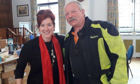 Lois Pryce with fellow biker in the LitFest cafe at the Town Hall