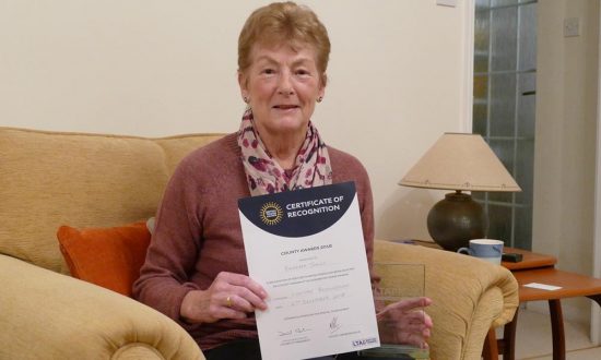 Barbara Jones with her Certificate of Recognition and the glass engraved Lifetime Achievement Award