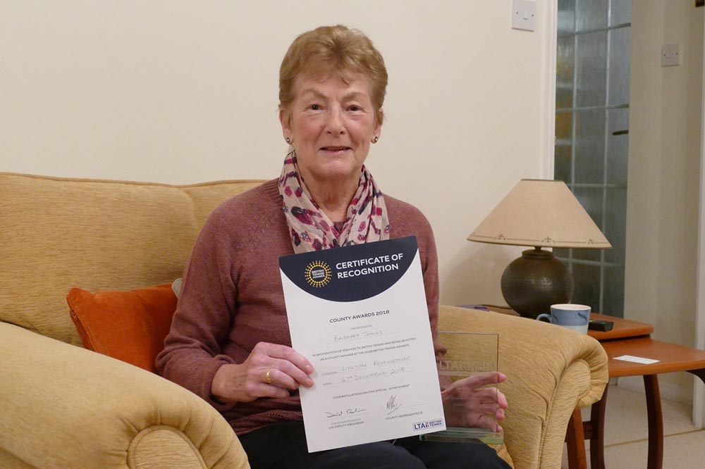 Barbara Jones with her Certificate of Recognition and the glass engraved Lifetime Achievement Award 