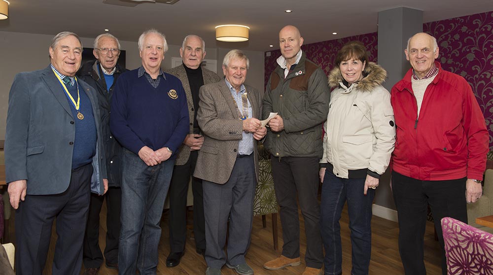 Marlborough Rotary Chairman Stewart Dailly presents Marlborough British Legion Chairman Alek Sagar with the cheque for £155, collected at last November's Beacon Armistice commemoration on the Common.  Also present are (l-r) Gerry Hooper (a past Rotary president), Peter Mansfield (a past Rotary president), Martin Luxford (a past Rotary president and also current president elect), Edward Ferguson, Marian Hannaford Dobson (BL Branch Treasurer) and Stewart Dobson (BL Branch Secretary)