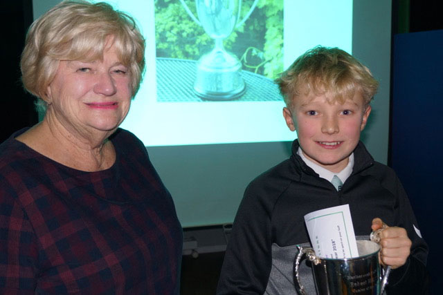 Oscar being presented with the Robert Hill trophy on Presentation Night by Rosie Hill, wife of the late Robert Hill