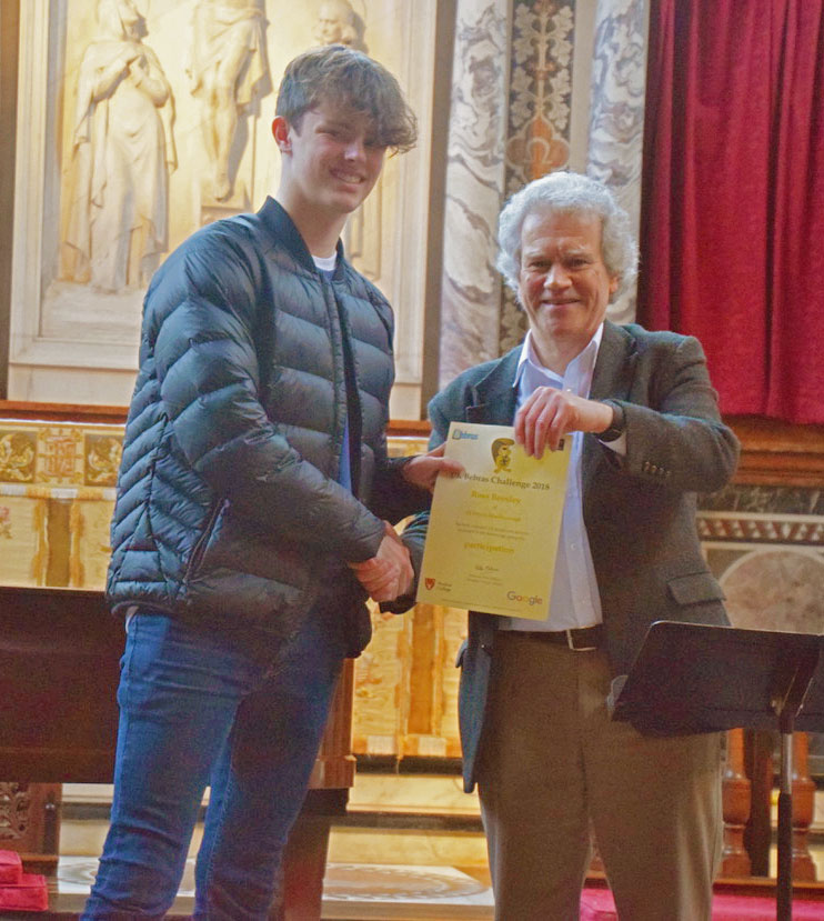 Ross Beesley of St Johns Academy receives his finalists' certificate from Peter Millican, Professor of Philosophy at Hertford College